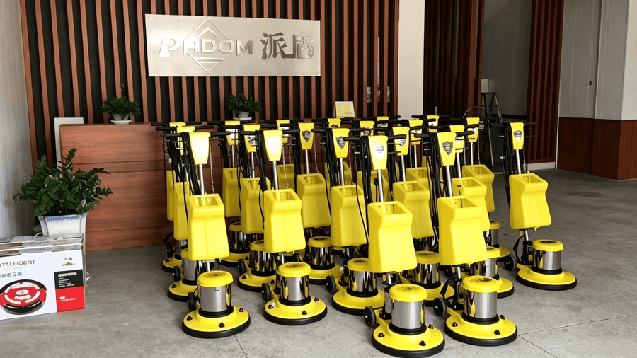 PADOM single disc floor machines displayed in the company showroom for commercial floor cleaning use